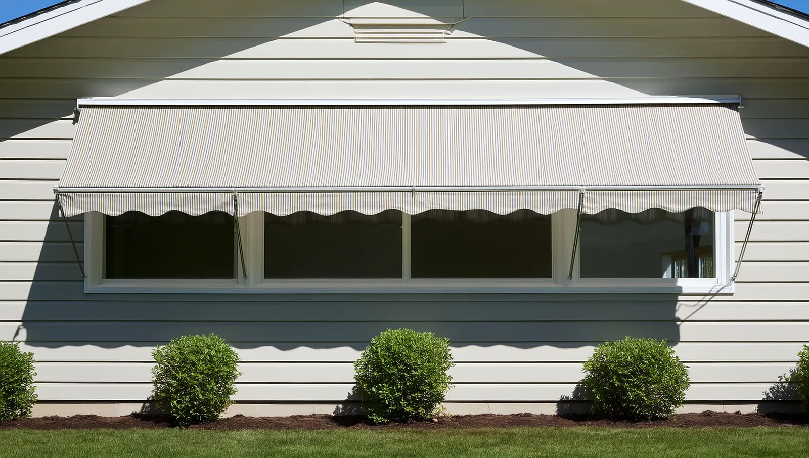 Striped awning over a wide ground floor window